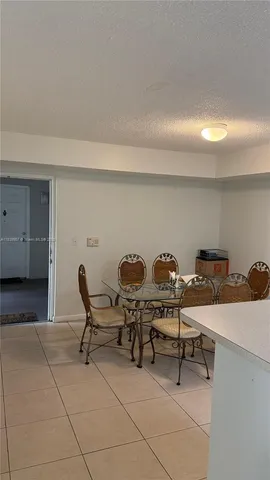 a work room with furniture and a rug