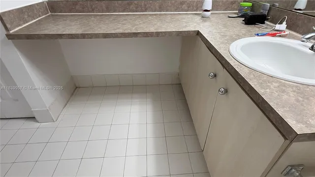 a bathroom with a sink and vanity