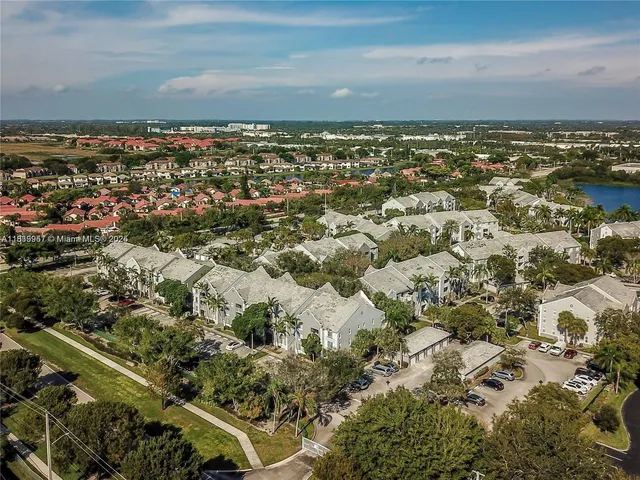 an aerial view of residential building and ocean