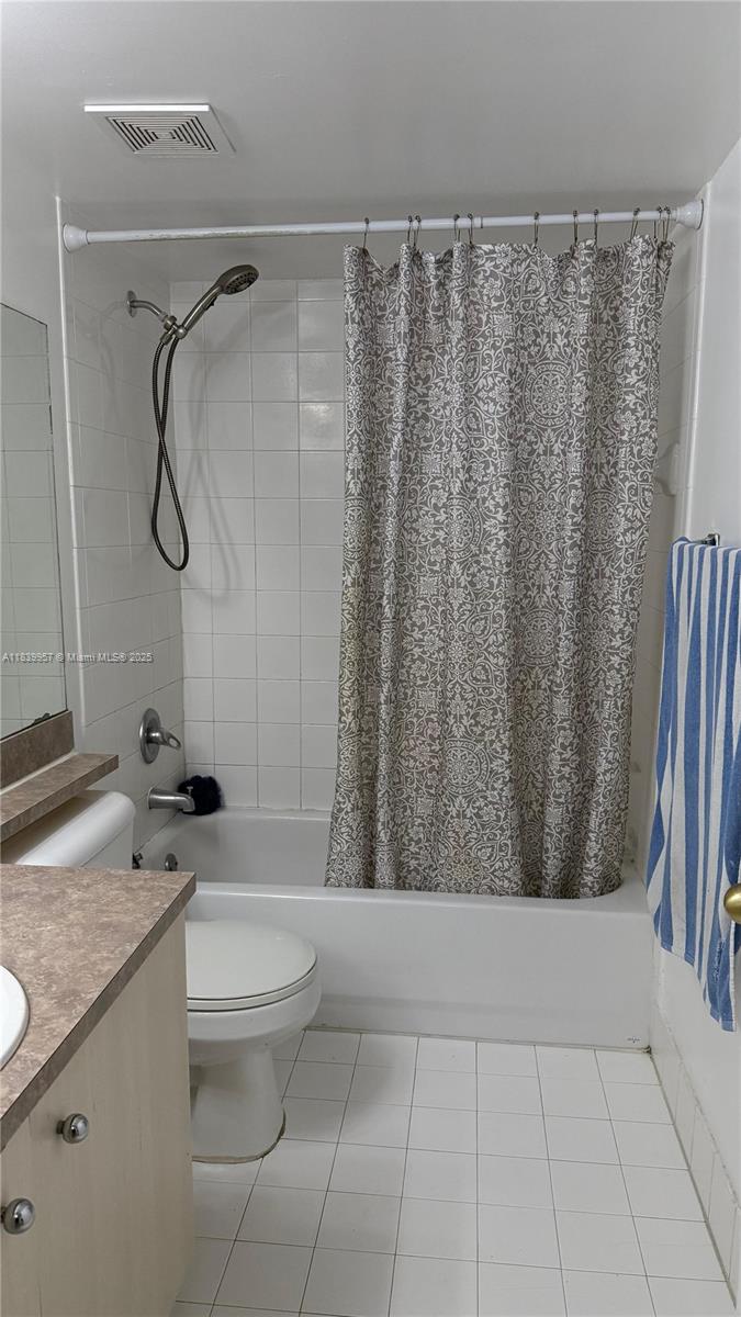 11133 Southwest 8th Street, Unit 102 Pembroke Pines, FL 33025 - Photo 9 of 35 a bathroom with a granite countertop bathtub sink vanity and toilet