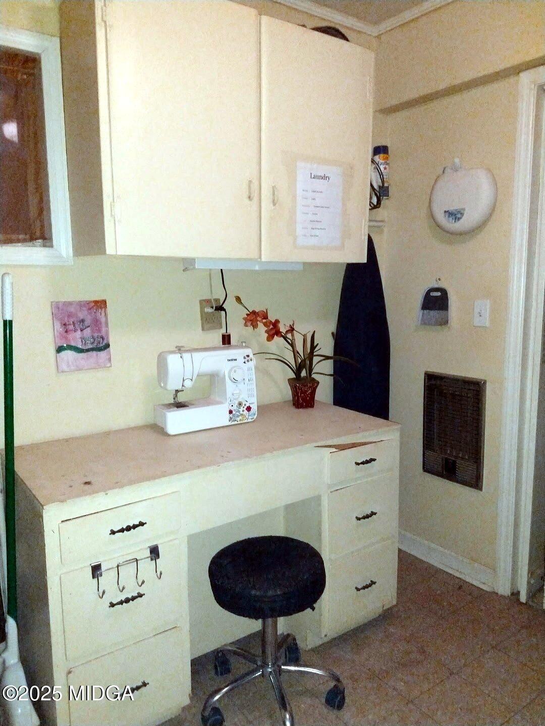152 North Main Street Gordon, GA 31031 - Photo 19 of 37 a room with a washing machine and a fireplace