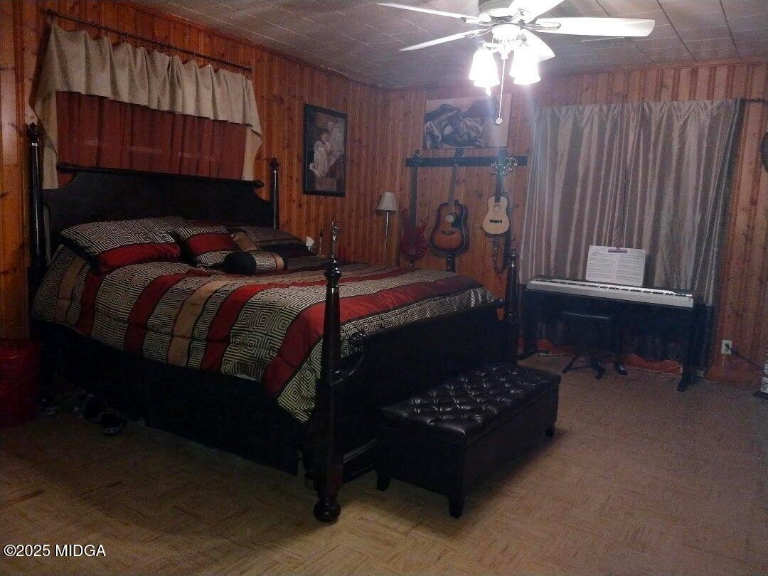 152 North Main Street Gordon, GA 31031 - Photo 22 of 37 a bedroom with a bed window and a chandelier