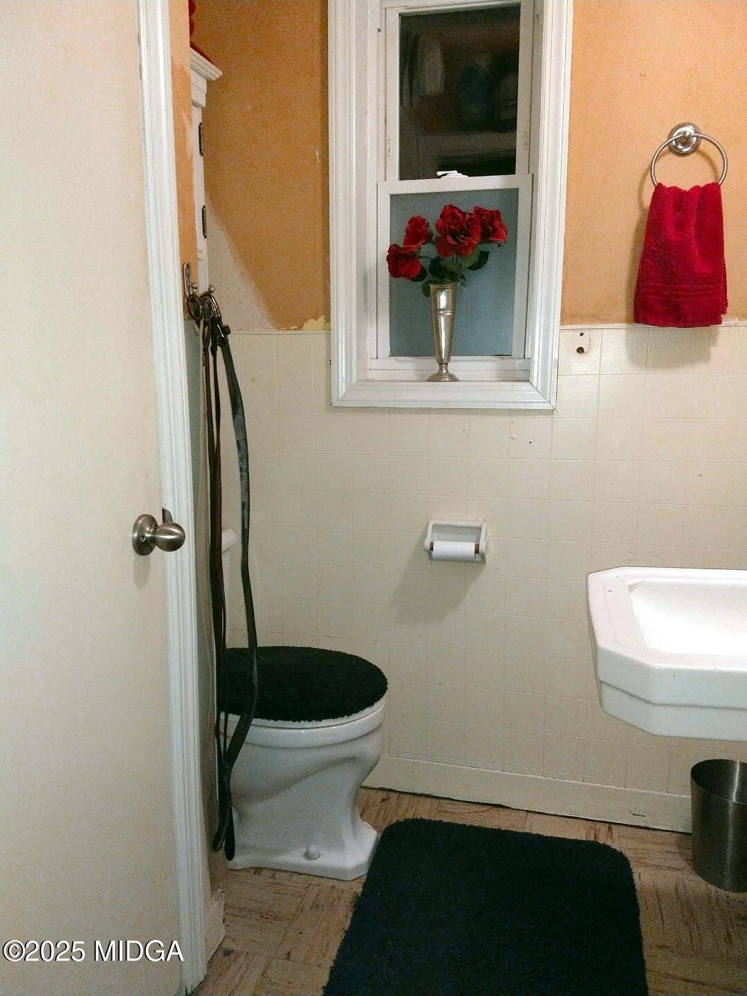 152 North Main Street Gordon, GA 31031 - Photo 24 of 37 a bathroom with a toilet and a sink