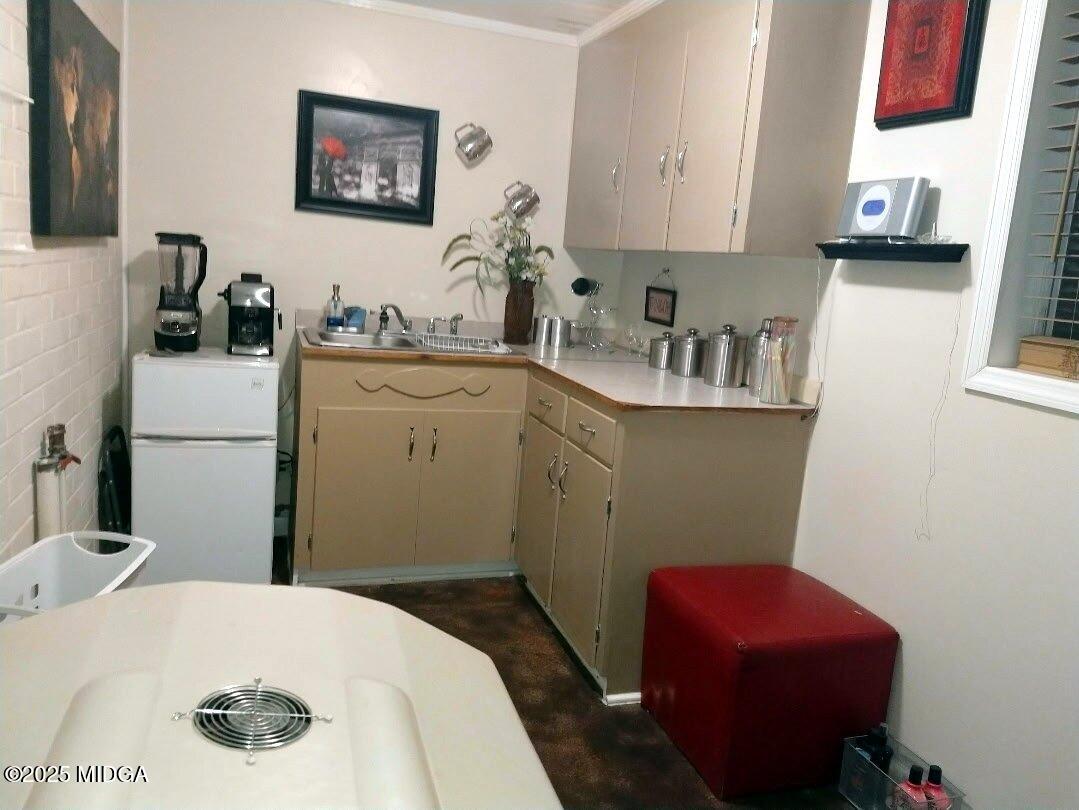 152 North Main Street Gordon, GA 31031 - Photo 25 of 37 a bedroom with a bed and a chair in it