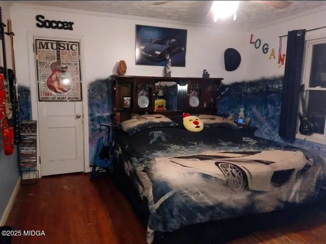 a bedroom with a bed and dresser