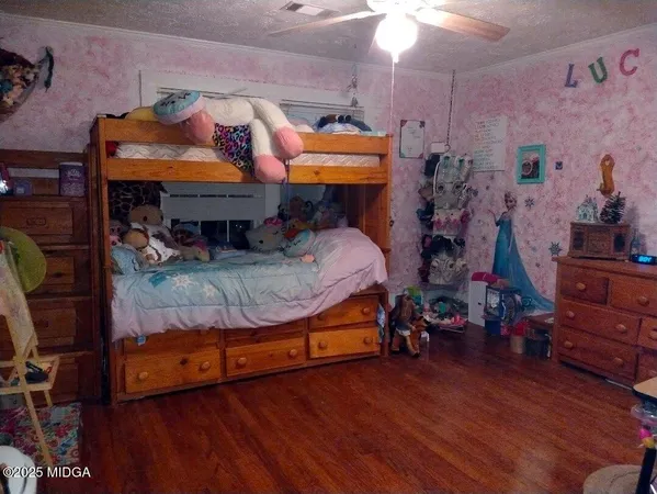 a room with wooden floors and furniture