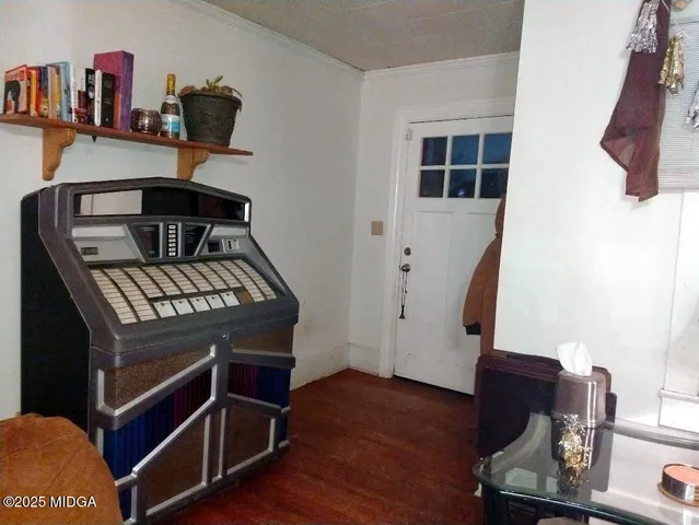 a view of an entryway with wooden floor