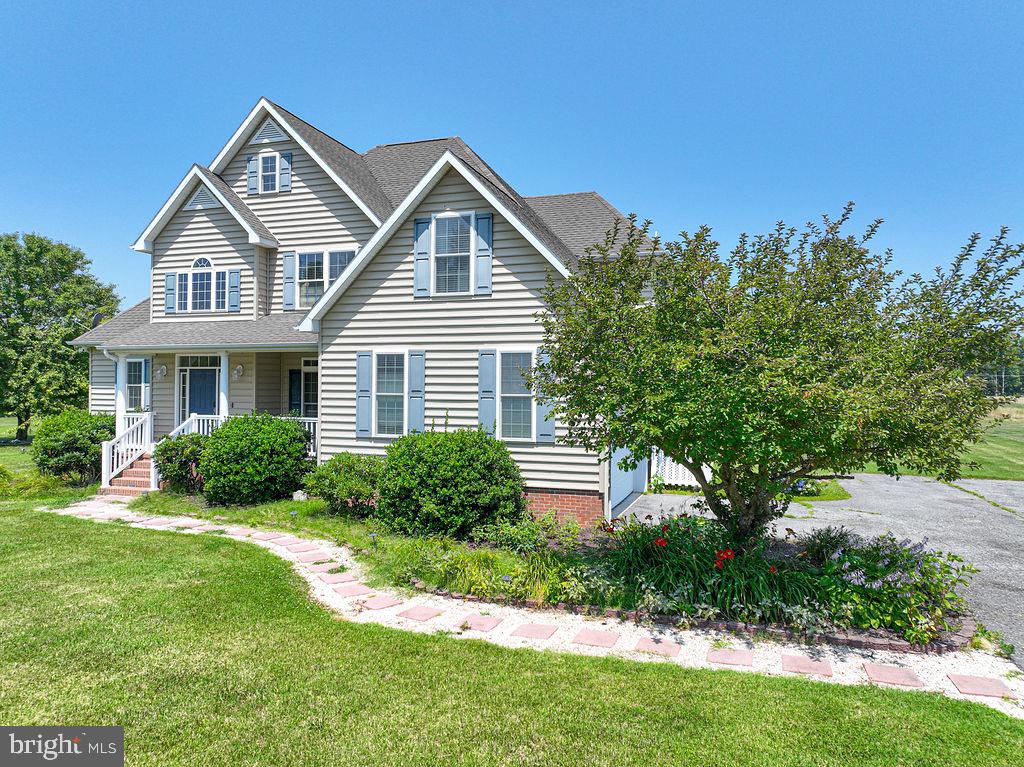 10671 Cathell Road Berlin, MD 21811 - Photo 60 of 63 a front view of a house with a yard