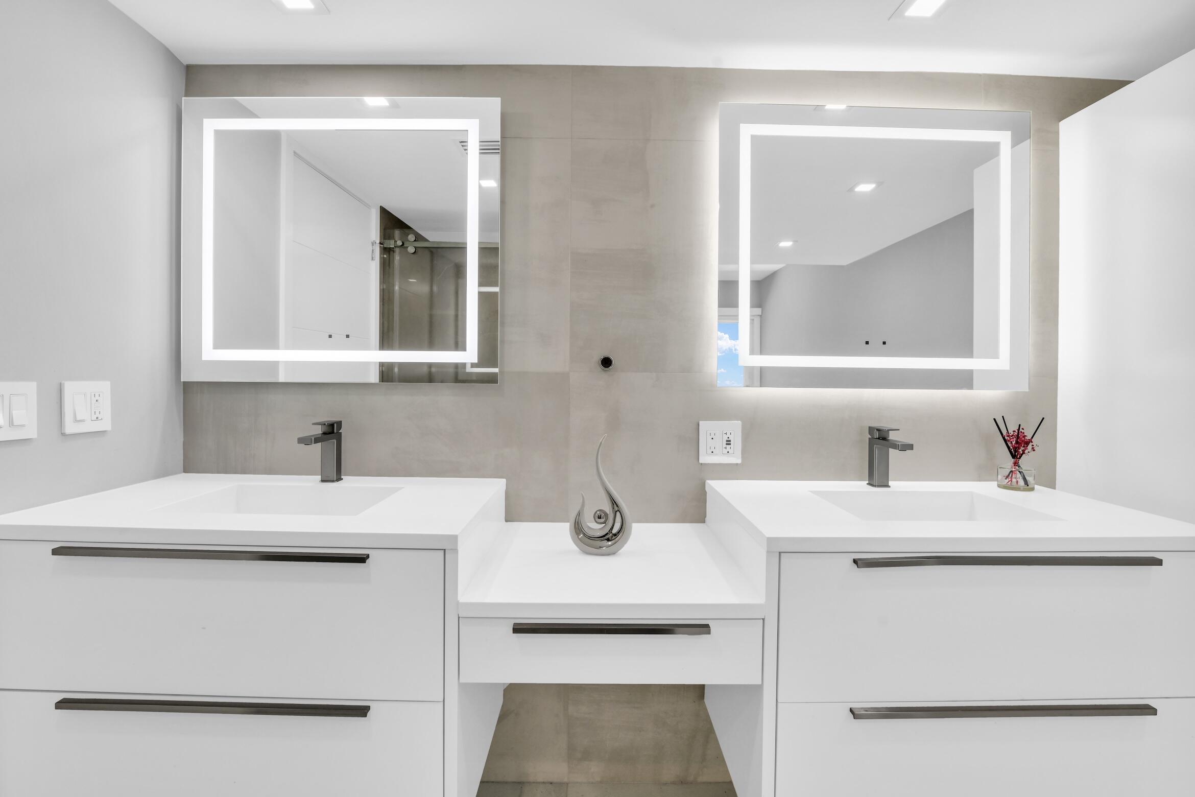 2000 South Ocean Boulevard, Unit 6K Boca Raton, FL 33432 - Photo 25 of 93 a bathroom with a sink vanity and mirror
