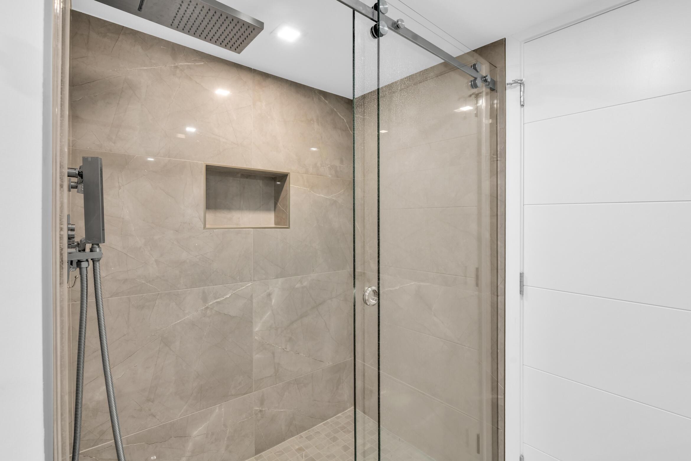 2000 South Ocean Boulevard, Unit 6K Boca Raton, FL 33432 - Photo 26 of 93 a bathroom with a shower and a glass door
