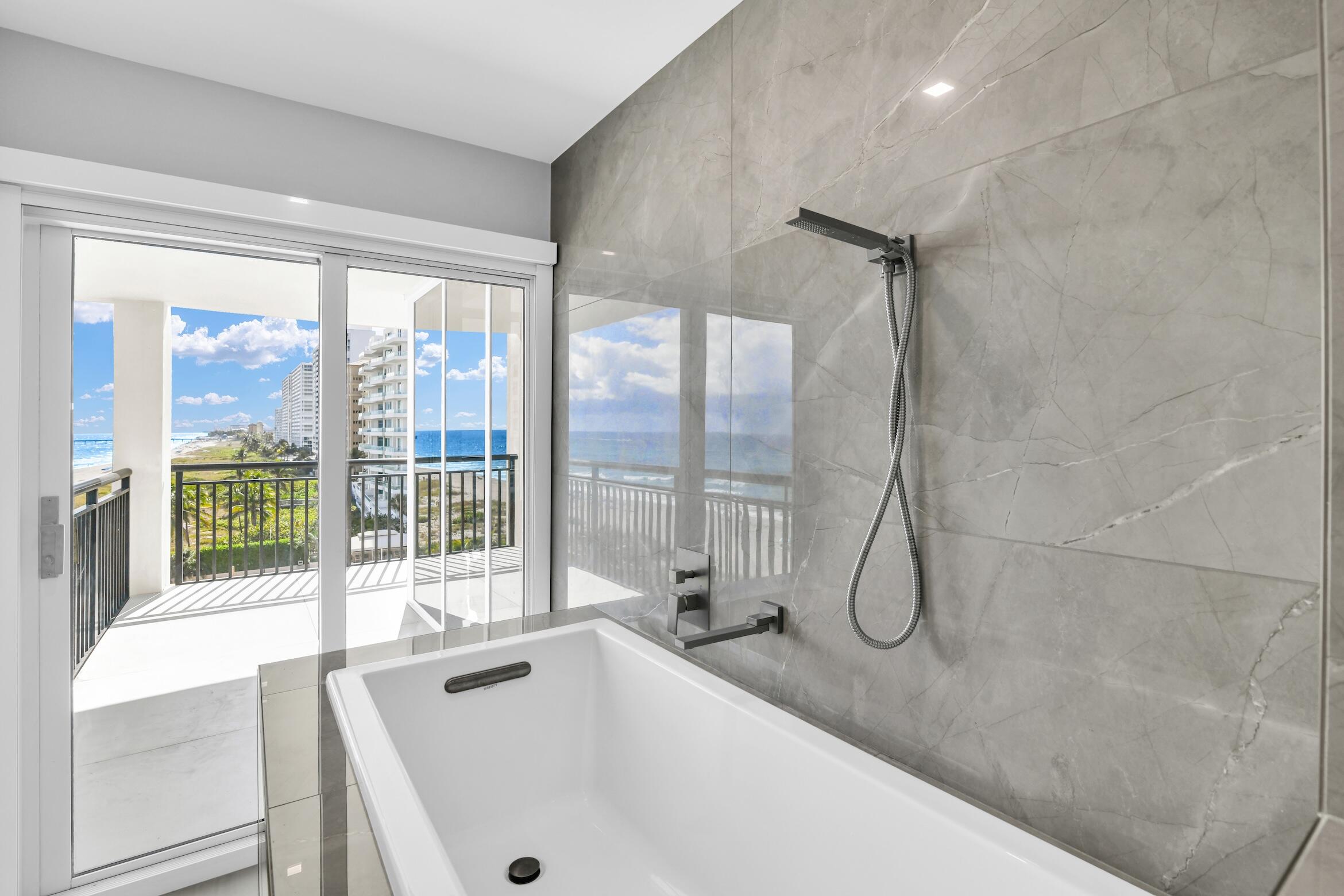 2000 South Ocean Boulevard, Unit 6K Boca Raton, FL 33432 - Photo 28 of 93 a bathroom with a tub and a large window