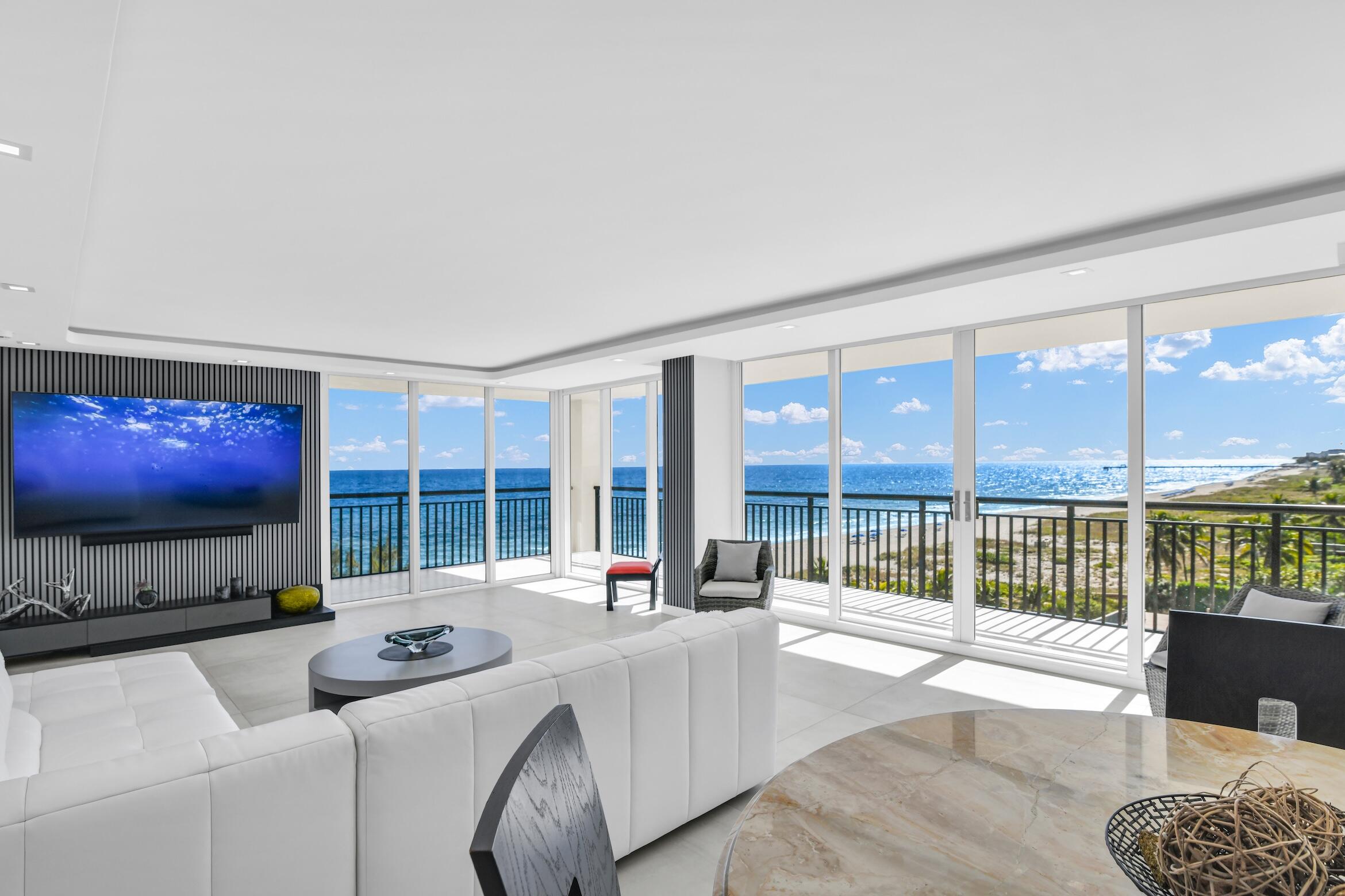 2000 South Ocean Boulevard, Unit 6K Boca Raton, FL 33432 - Photo 6 of 93 a living room with furniture a floor to ceiling window and flat screen tv