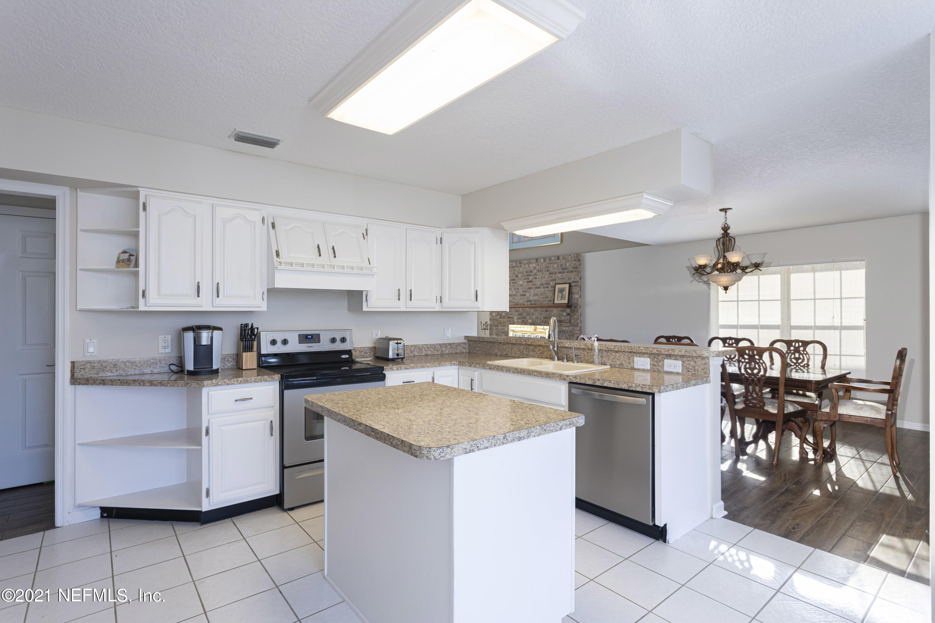 6348 Salado Road St. Augustine, FL 32080 - Photo 15 of 48 a kitchen with a sink stove and cabinets