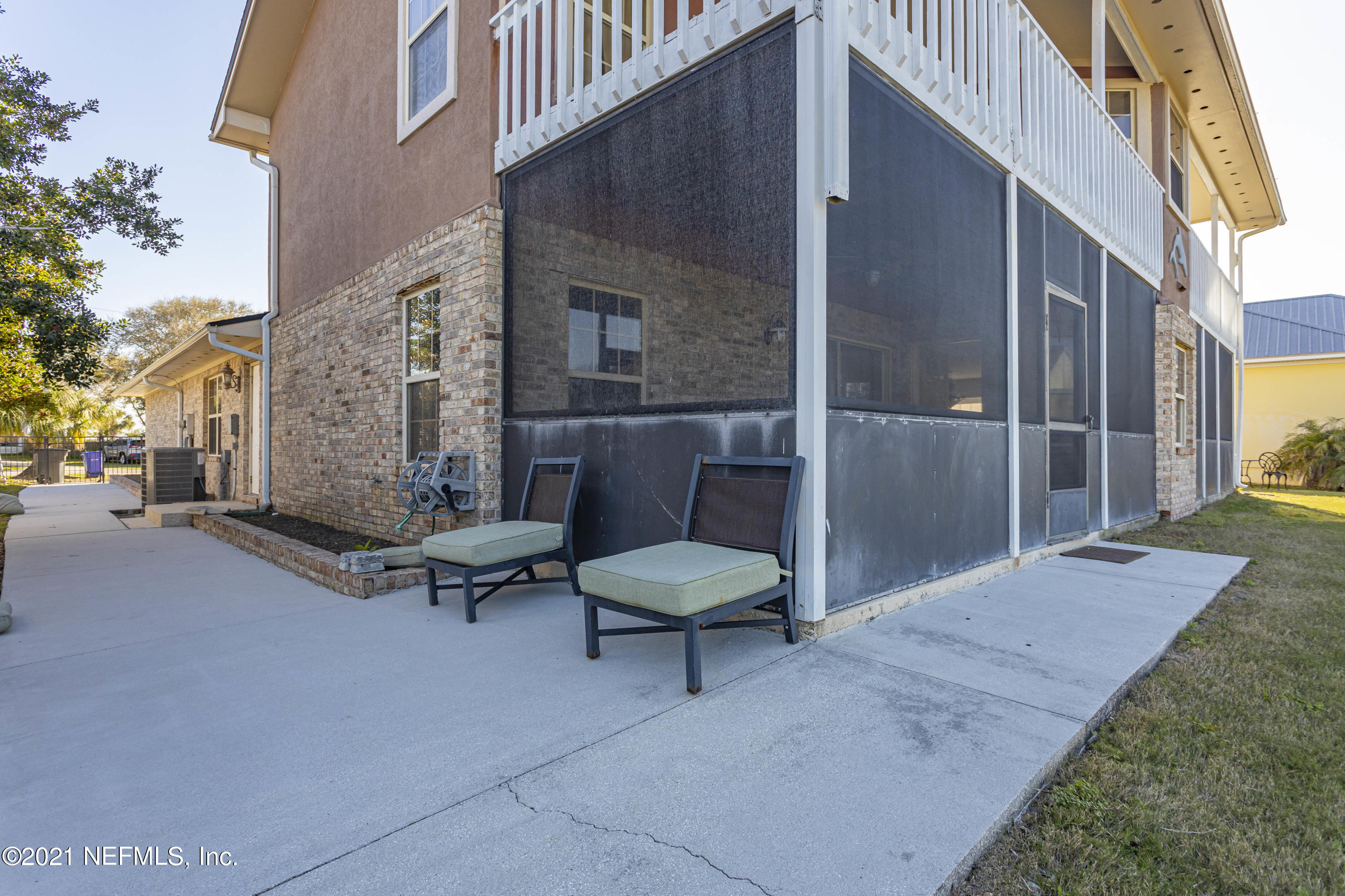 6348 Salado Road St. Augustine, FL 32080 - Photo 18 of 48 a view of a patio with a table and chairs