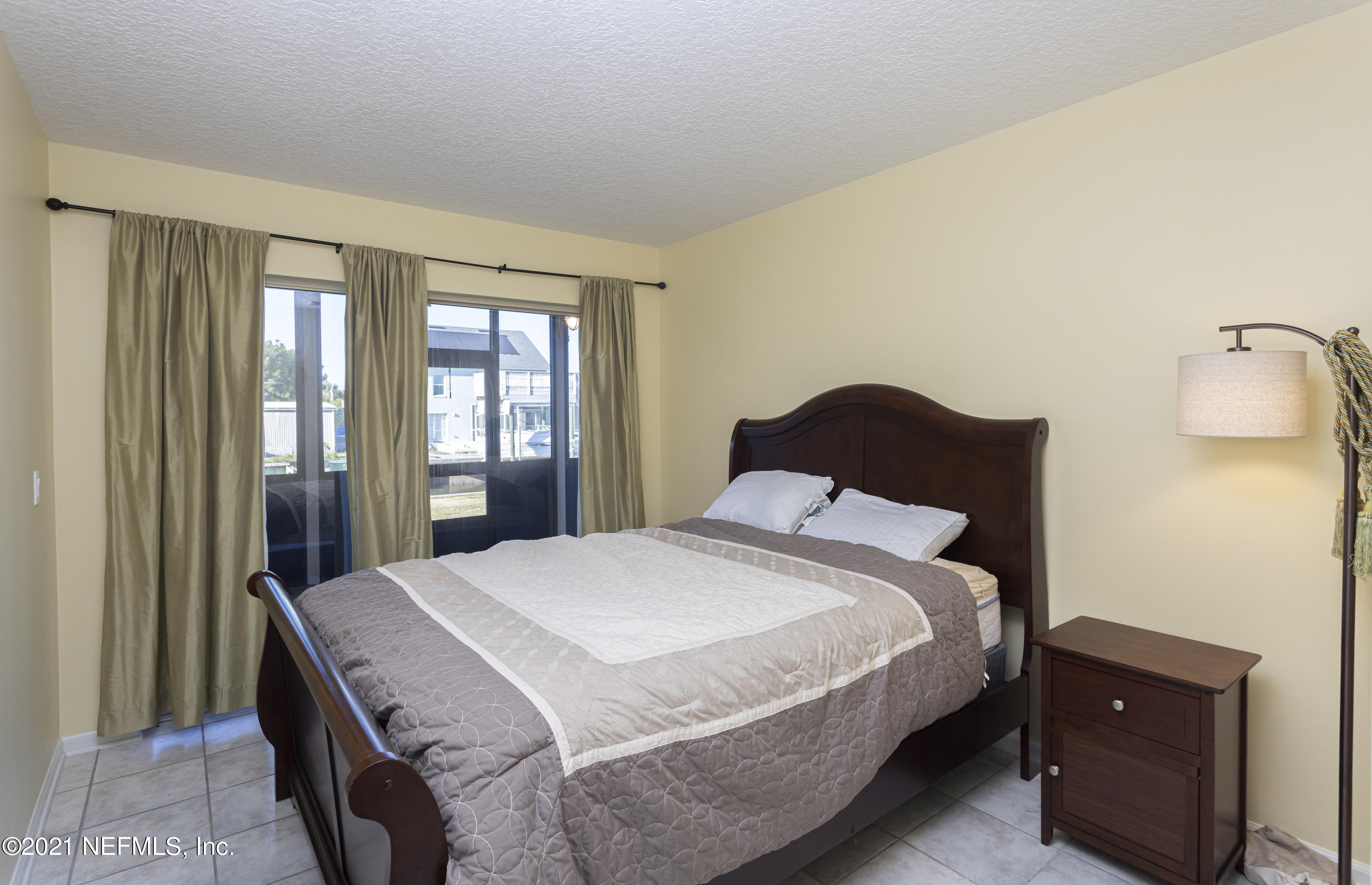 6348 Salado Road St. Augustine, FL 32080 - Photo 27 of 48 a bedroom with a bed and wooden floor