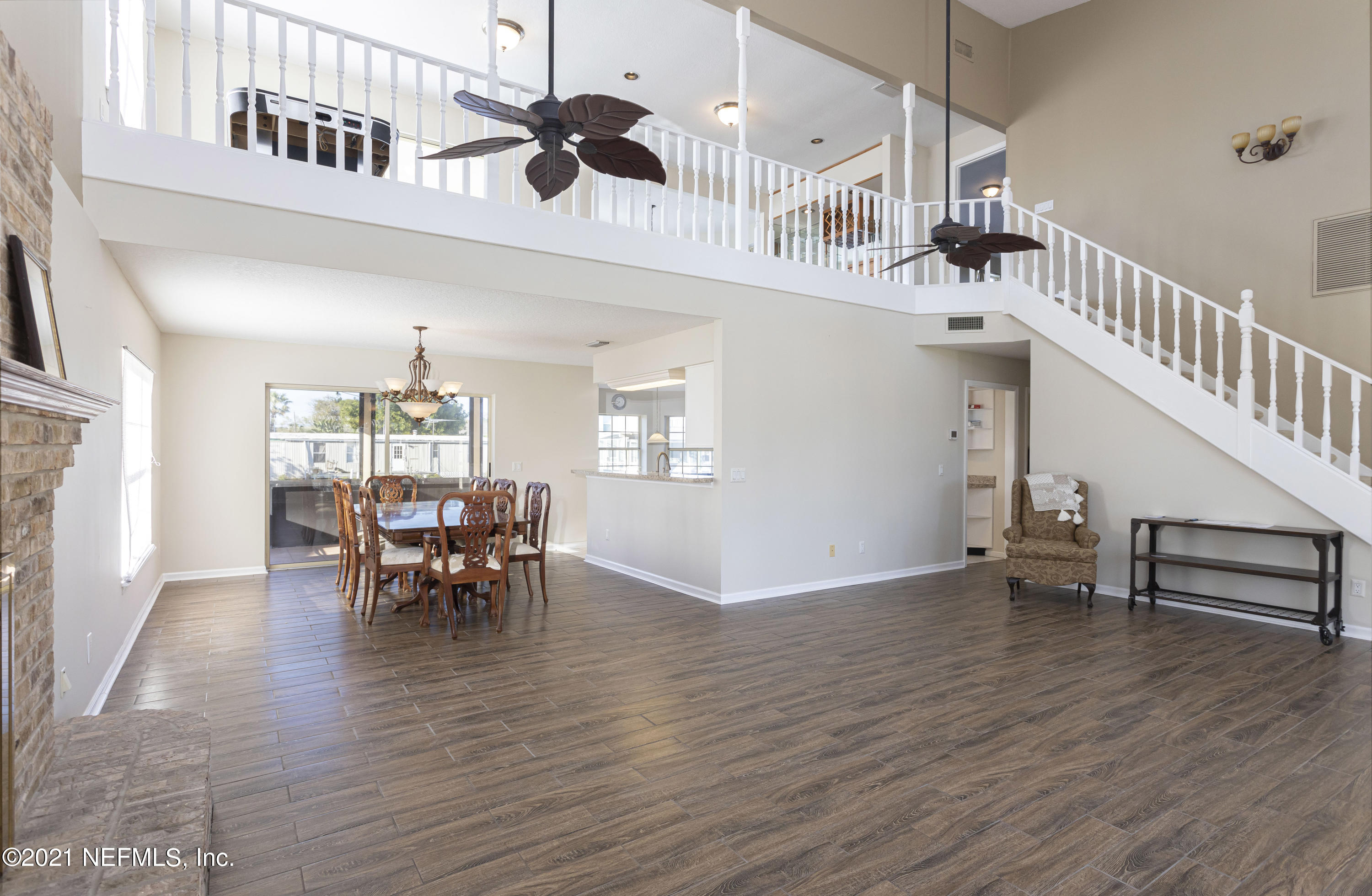 6348 Salado Road St. Augustine, FL 32080 - Photo 7 of 48 a view of dining room and hall with wooden floor