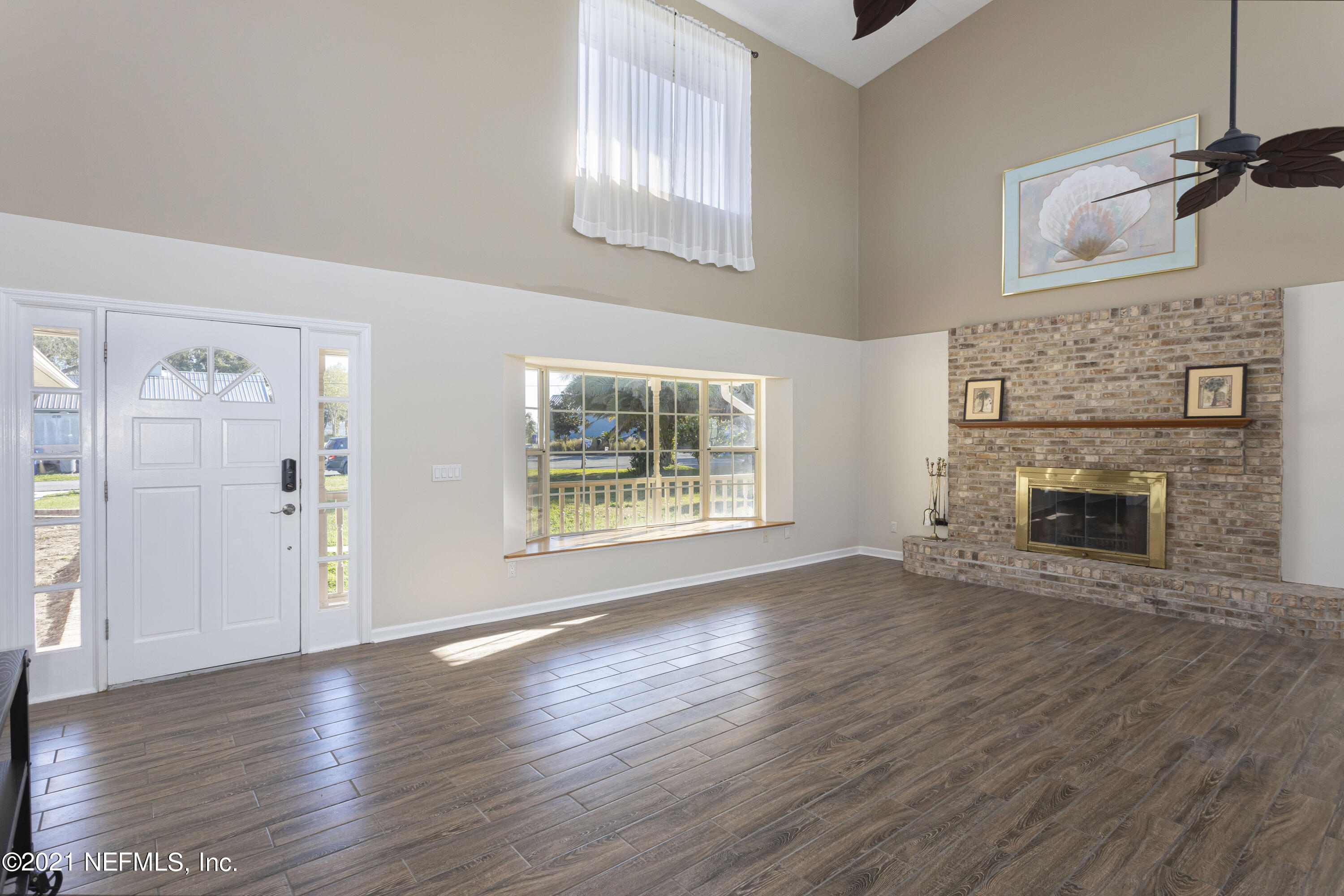 6348 Salado Road St. Augustine, FL 32080 - Photo 10 of 48 a view of a livingroom with wooden floor and a fireplace