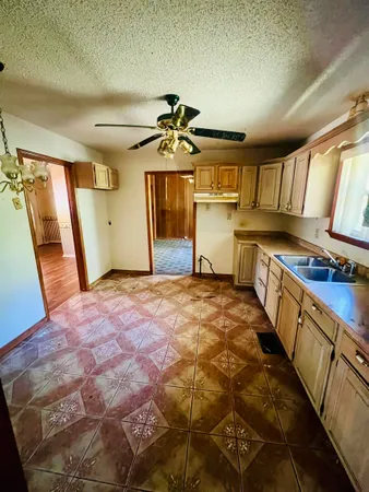 a bathroom with a sink a mirror and a shower