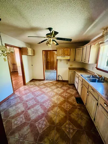 a bathroom with a sink a mirror and a shower