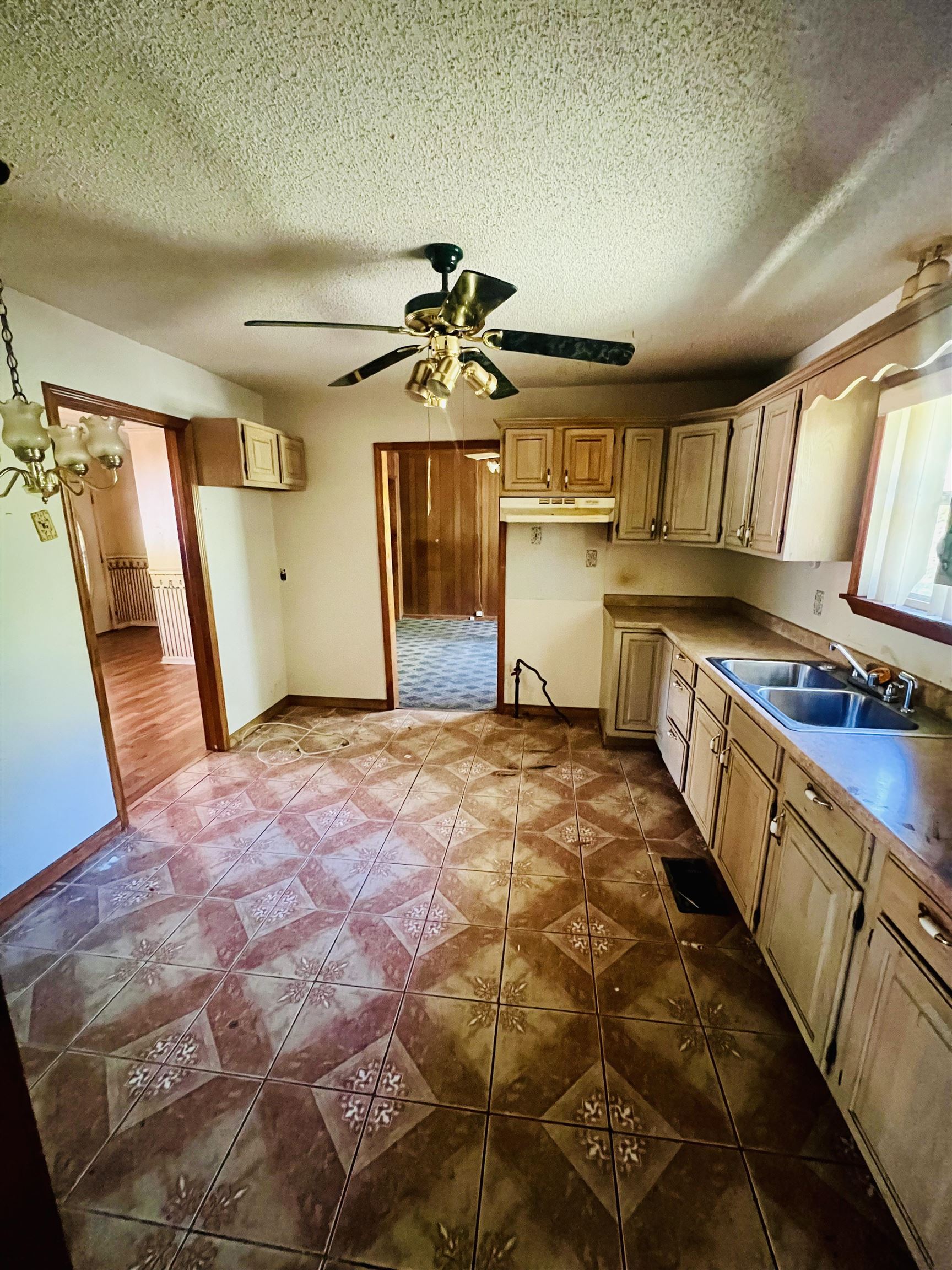 900 Peete Street Covington, TN 38019 - Photo 3 of 6 a bathroom with a sink a mirror and a shower