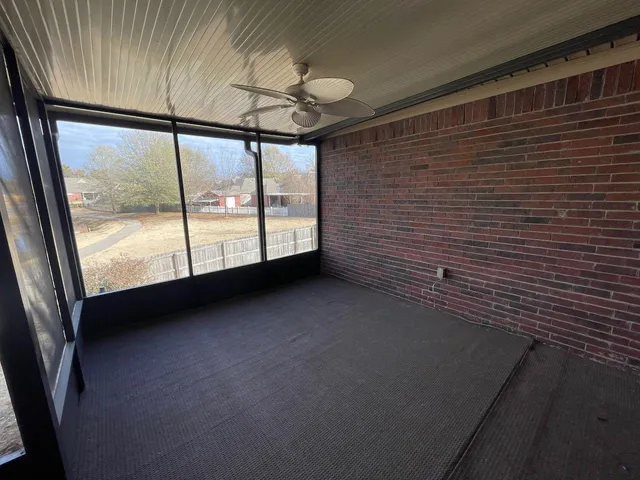 a view of balcony with wooden floor