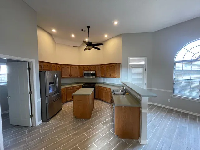 a kitchen with counter top space and stainless steel appliances