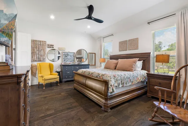 a bed room with a bed and a television