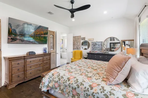 a bathroom with a double vanity sink mirror and bathtub