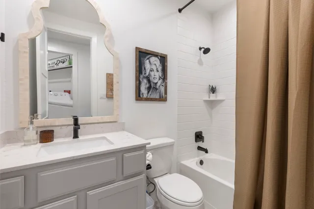 a bedroom with bed and a chandelier