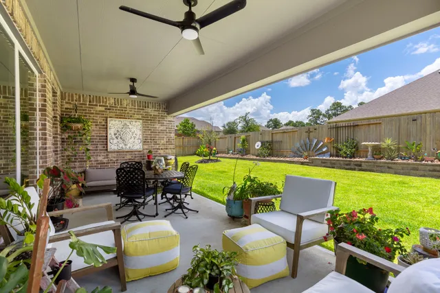 a view of a house with swimming pool and a yard