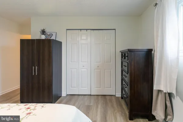 an entryway with wooden floor