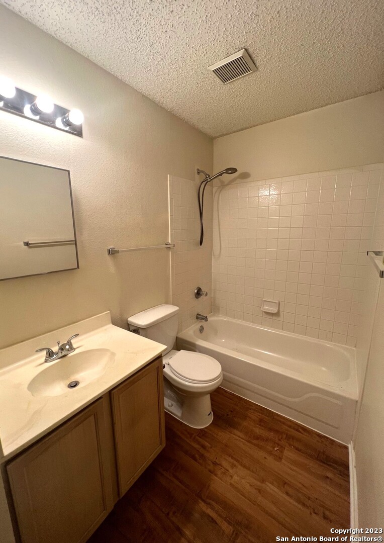 8615 Cross Spring San Antonio, TX 78251 - Photo 11 of 15 a bathroom with a sink a toilet and shower