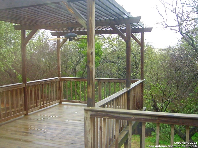8615 Cross Spring San Antonio, TX 78251 - Photo 13 of 15 a view of a wooden deck next to a yard