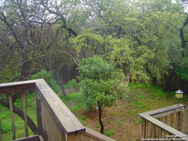 8615 Cross Spring San Antonio, TX 78251 - Photo 14 of 15 a view of backyard with green space and seating area