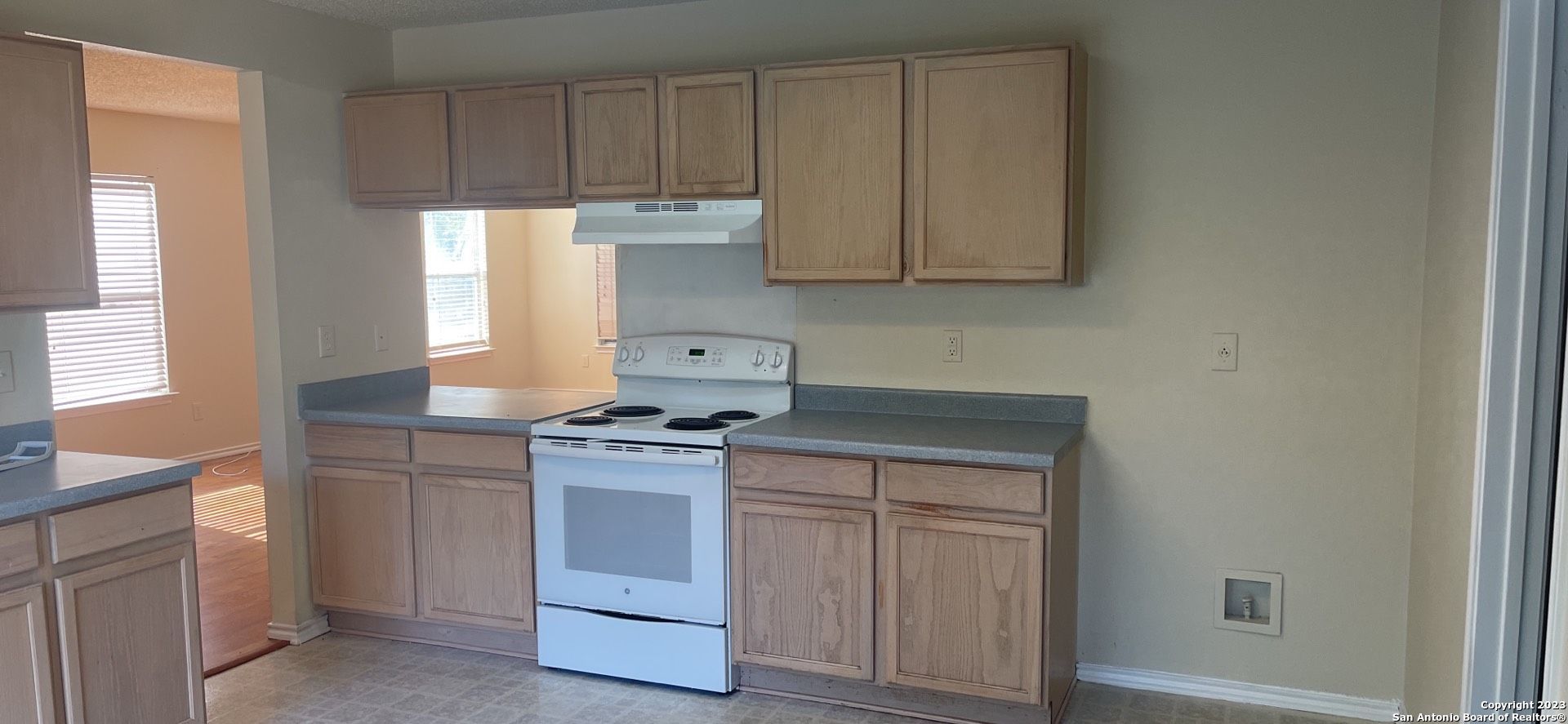 8615 Cross Spring San Antonio, TX 78251 - Photo 4 of 15 a kitchen with cabinets appliances and a window