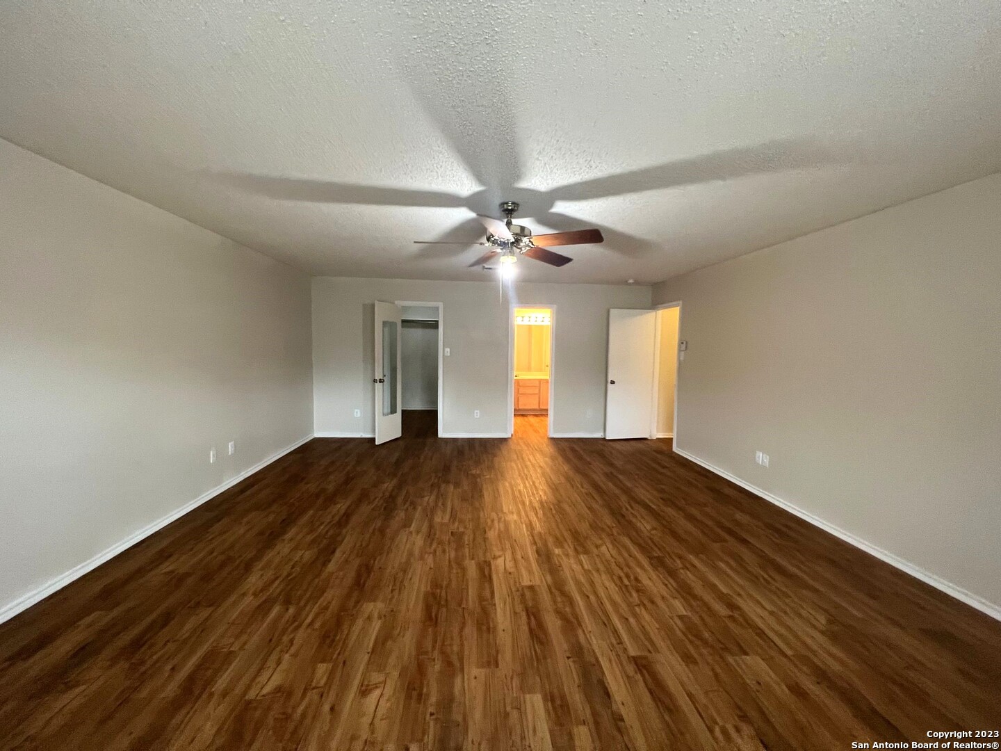 8615 Cross Spring San Antonio, TX 78251 - Photo 8 of 15 a view of an empty room and wooden floor