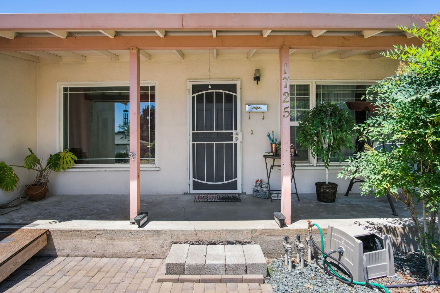 1725 Bronson Avenue Modesto, CA 95350 - Photo 3 of 17 a front view of a house with a yard