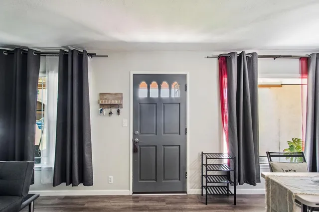 a view of front door with entryway and stairs