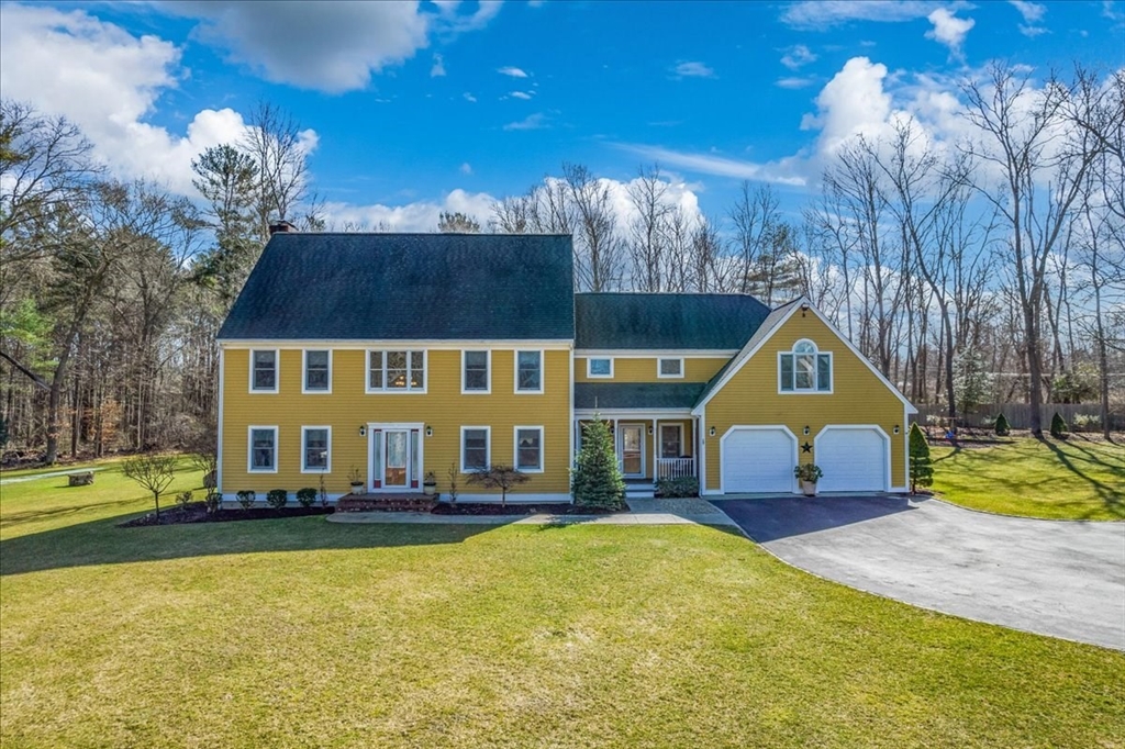 14 Robinson Road Rochester, MA 02770 - Photo 1 of 42 a aerial view of a house with swimming pool and large trees