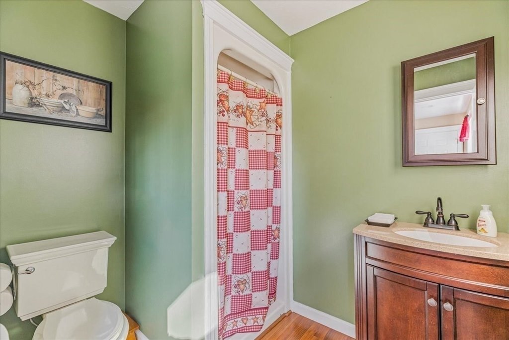 14 Robinson Road Rochester, MA 02770 - Photo 13 of 42 a bathroom with a toilet a sink and mirror
