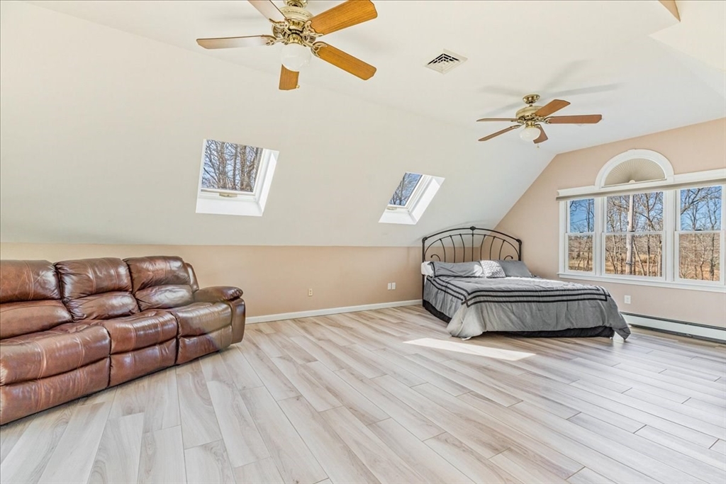 14 Robinson Road Rochester, MA 02770 - Photo 16 of 42 a living room with furniture and a wooden floor