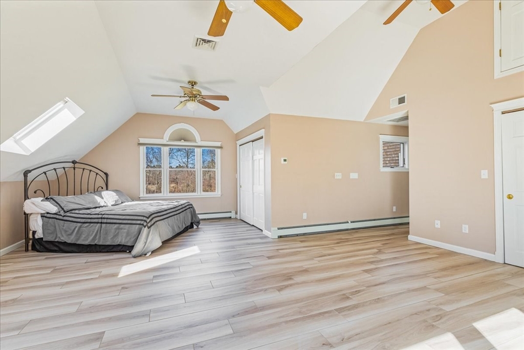 14 Robinson Road Rochester, MA 02770 - Photo 18 of 42 an empty room with wooden floor and windows