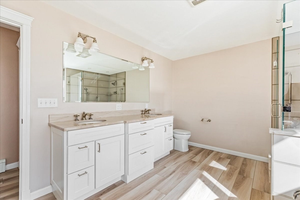 14 Robinson Road Rochester, MA 02770 - Photo 19 of 42 a spacious bathroom with a double vanity sink and a mirror