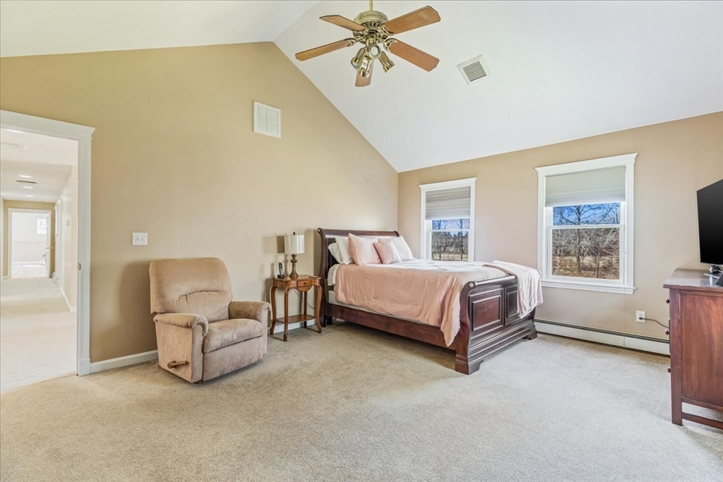 14 Robinson Road Rochester, MA 02770 - Photo 21 of 42 a bedroom with a bed and ceiling fan