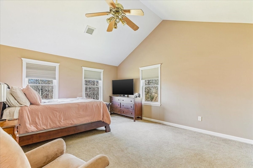 14 Robinson Road Rochester, MA 02770 - Photo 22 of 42 a bedroom with a bed and glass wall