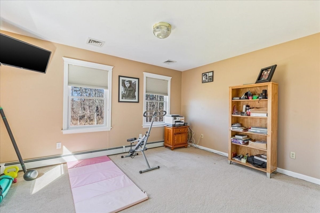 14 Robinson Road Rochester, MA 02770 - Photo 25 of 42 a room with furniture and a flat screen tv