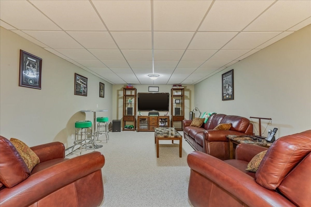 14 Robinson Road Rochester, MA 02770 - Photo 26 of 42 a living room with furniture and a flat screen tv