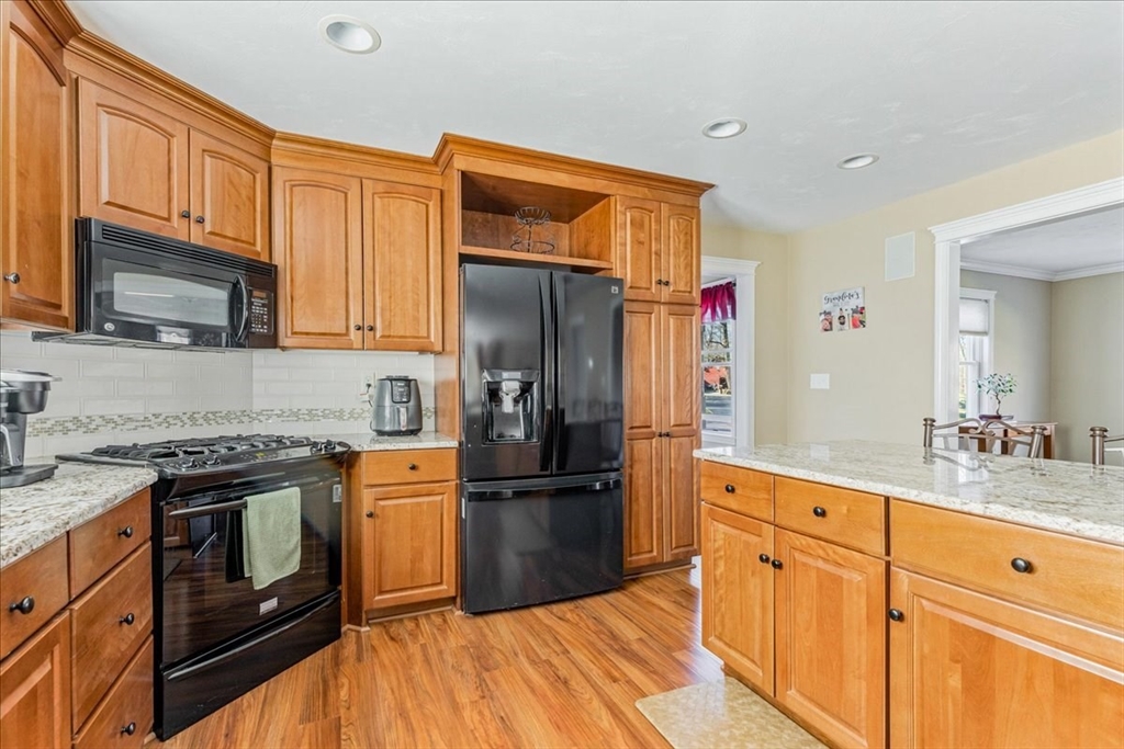14 Robinson Road Rochester, MA 02770 - Photo 4 of 42 a kitchen with stainless steel appliances granite countertop a refrigerator stove and sink
