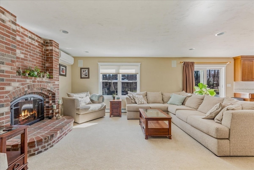 14 Robinson Road Rochester, MA 02770 - Photo 10 of 42 a living room with furniture and a fireplace