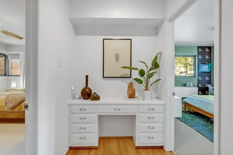 a view of living room with furniture and lamp